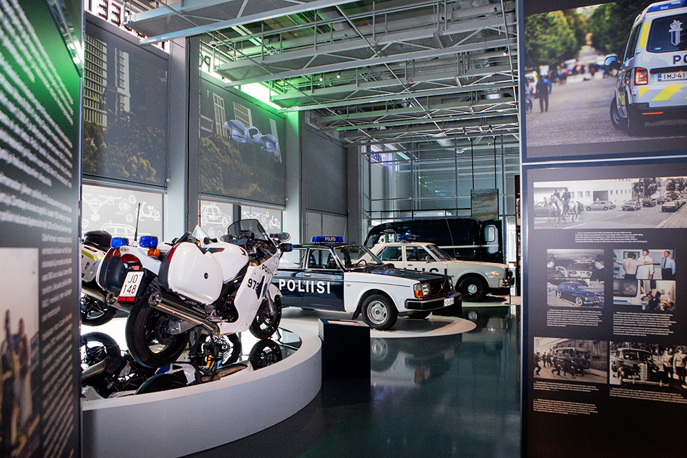 Overview of Police Museum special exhibition, with police cars and motorcycles on display.