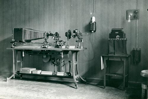 A black-and-white photograph of a large, complex photography device on a table.
