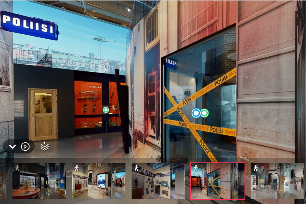 A screenshot of a virtual demonstration, in the exhibition facilities for example, the ‘Poliisi’ (the police) sign and Police – Do Not Cross tape.